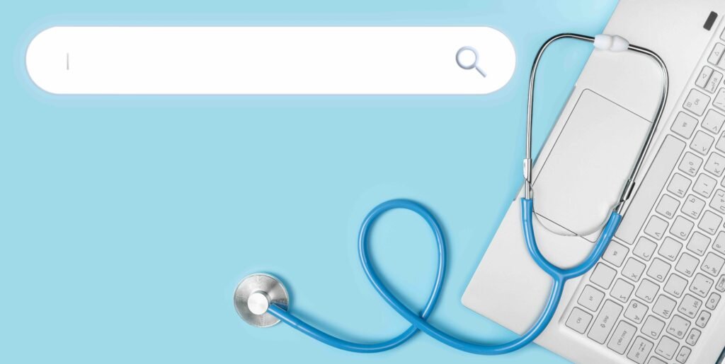 Stethoscope in a heart shape on a laptop beside a search bar, symbolizing healthcare SEO and how patients find doctors online.